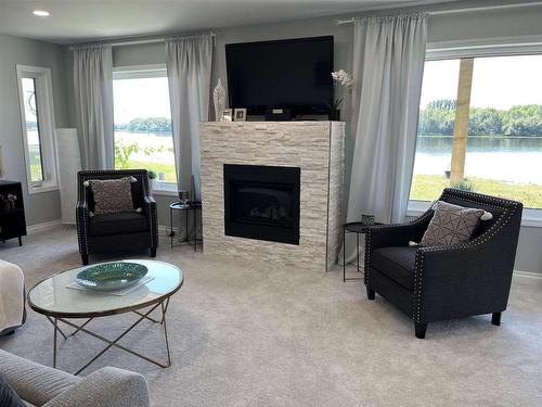 Rainy River, ON - Indoor Photo Showing Living Room With Fireplace