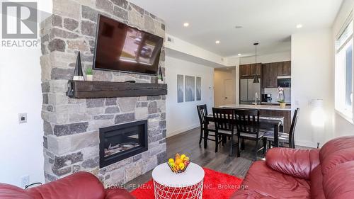 #202 -10 Beausoleil Lane, Blue Mountains, ON - Indoor Photo Showing Living Room With Fireplace
