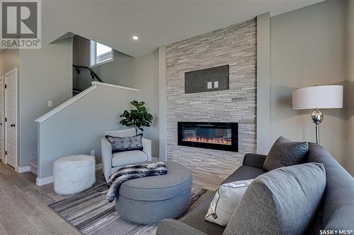 166 Kostiuk Crescent, Saskatoon, SK - Indoor Photo Showing Living Room With Fireplace