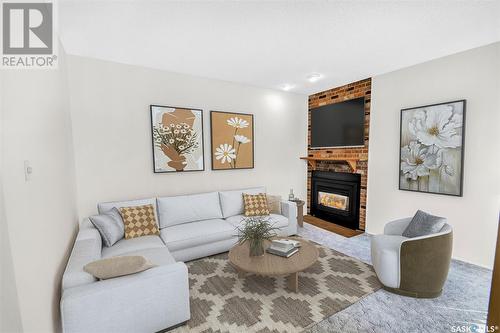 10 303 Saguenay Drive, Saskatoon, SK - Indoor Photo Showing Living Room With Fireplace