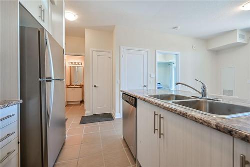 16 Concord Place|Unit #124, Grimsby, ON - Indoor Photo Showing Kitchen With Double Sink