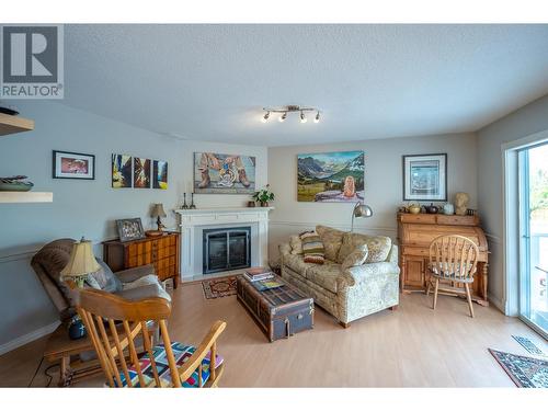 166 Heather Place, Penticton, BC - Indoor Photo Showing Living Room With Fireplace