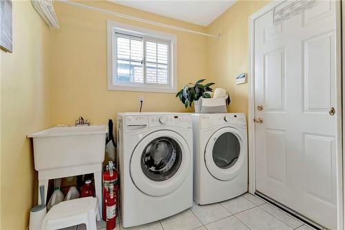 Main floor laundry, leads to double garage. - 501 Winona Road, Stoney Creek, ON - Indoor Photo Showing Laundry Room