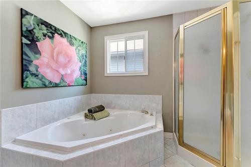 Jetted soaker tub and walk-in shower: you get to have both! - 501 Winona Road, Stoney Creek, ON - Indoor Photo Showing Bathroom