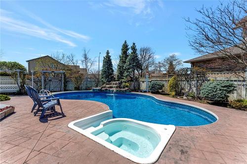And it's got a hot tub! Who doesn't love a good soak? - 501 Winona Road, Stoney Creek, ON - Outdoor With In Ground Pool With Backyard