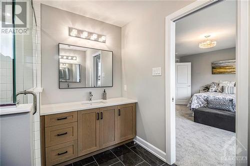 Spa-like ensuite with two vanities & tiled walk-in shower - 348 Ventoux Avenue, Ottawa, ON - Indoor Photo Showing Bathroom