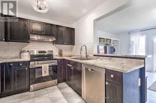 821 Silverfox Crescent, London, ON - Indoor Photo Showing Kitchen With Stainless Steel Kitchen With Double Sink With Upgraded Kitchen