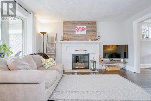 28 Sixth Street, Toronto, ON - Indoor Photo Showing Living Room With Fireplace