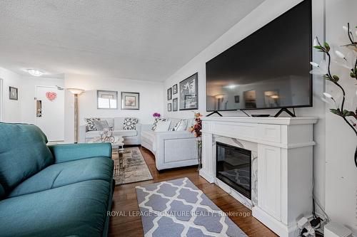 1406-80 Inverlochy Blvd, Markham, ON - Indoor Photo Showing Living Room With Fireplace