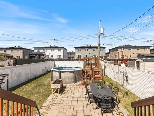 Backyard - 7395 Rue Lachance, Laval (Duvernay), QC - Outdoor With Above Ground Pool With Deck Patio Veranda