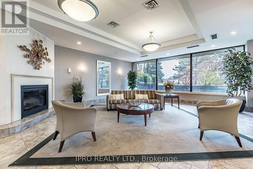 #1001 -4235 Sherwoodtowne Blvd, Mississauga, ON - Indoor With Fireplace