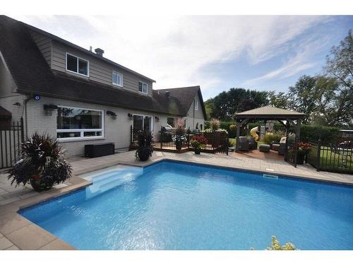 Vue d'ensemble - 11 Rue Augier, Laval (Auteuil), QC - Outdoor With In Ground Pool With Backyard