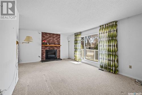 2589 15Th Avenue E, Prince Albert, SK - Indoor Photo Showing Living Room With Fireplace