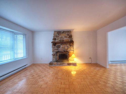 Salon - 8705 Boul. Rivard, Brossard, QC - Indoor Photo Showing Living Room With Fireplace
