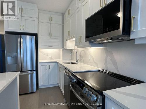 #417 -3265 Carding Mill Tr, Oakville, ON - Indoor Photo Showing Kitchen With Upgraded Kitchen
