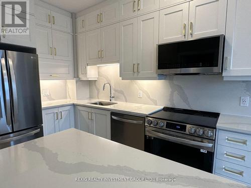 #417 -3265 Carding Mill Tr, Oakville, ON - Indoor Photo Showing Kitchen With Upgraded Kitchen
