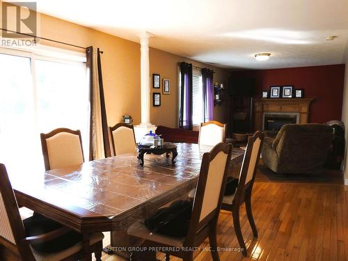154 Kingfisher Ave, Woodstock, ON - Indoor Photo Showing Dining Room With Fireplace
