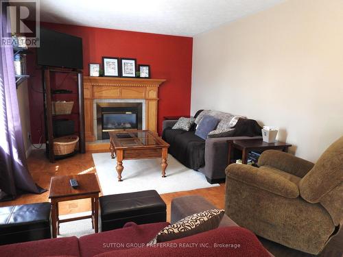 154 Kingfisher Ave, Woodstock, ON - Indoor Photo Showing Living Room With Fireplace