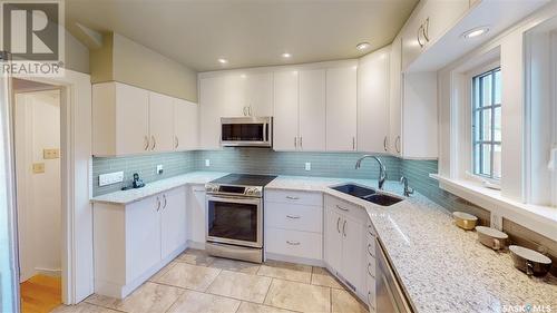75 Connaught Crescent, Regina, SK - Indoor Photo Showing Kitchen With Double Sink