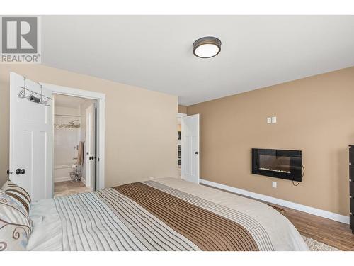 101 Skye Blue Loop, Princeton, BC - Indoor Photo Showing Bedroom With Fireplace