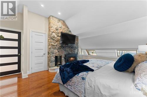 You can see the property has upgraded every door to add that modern feel.  Wood burning fireplace for those romantic evenings.  Beautiful skylights with remote controls overlooking the river.  Thi - 3756 Mapleshore Drive, Kemptville, ON - Indoor Photo Showing Bedroom