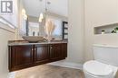 Gorgeous high end powder room situated inside the front door.  High end fixtures including stone basin and floating vanity. - 3756 Mapleshore Drive, Kemptville, ON  - Indoor Photo Showing Bathroom 