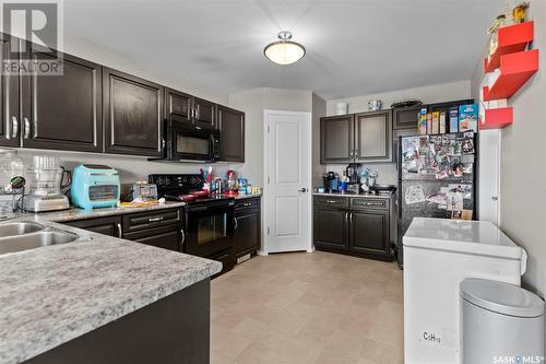330 100 Chaparral Boulevard, Martensville, SK - Indoor Photo Showing Kitchen With Double Sink