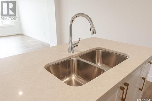 6 651 Dubois Crescent, Saskatoon, SK - Indoor Photo Showing Kitchen With Double Sink