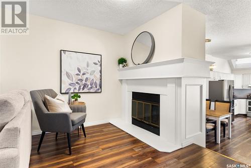 6 2338 Assiniboine Avenue, Regina, SK - Indoor Photo Showing Living Room With Fireplace