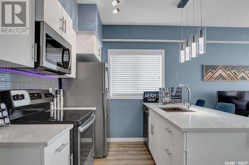 204A 3351 Green Poppy Street, Regina, SK - Indoor Photo Showing Kitchen With Double Sink