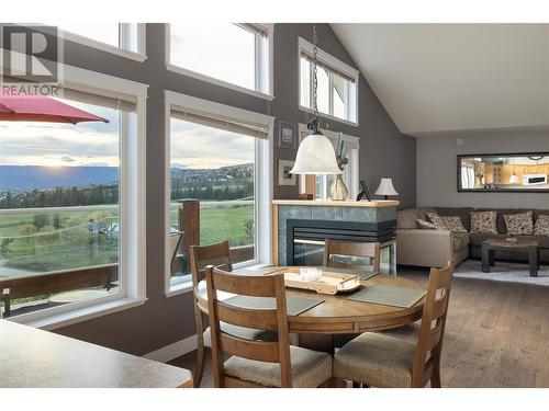 6435 Dixon Dam Road, Vernon, BC - Indoor Photo Showing Dining Room With Fireplace