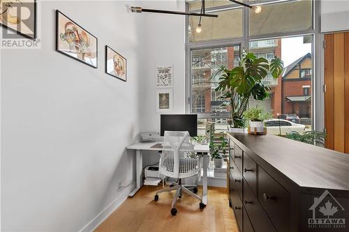 Current owner uses this space as the office/den but could easily be reversed. - 340 Mcleod Street Unit#105, Ottawa, ON - Indoor Photo Showing Office