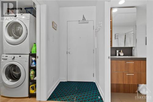 Access to the building with convenient storage locker across the hall. This is also a great way to access the amenities. - 340 Mcleod Street Unit#105, Ottawa, ON - Indoor Photo Showing Laundry Room