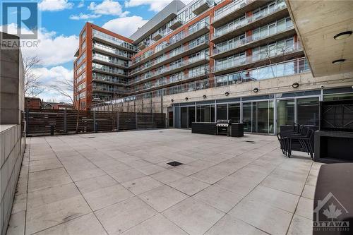 Large patio with bbq and tables set up! - 340 Mcleod Street Unit#105, Ottawa, ON - Outdoor