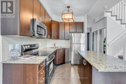 #713 -225 Webb Dr, Mississauga, ON - Indoor Photo Showing Kitchen With Double Sink With Upgraded Kitchen