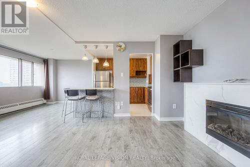 #1705 -10 Sunny Glen Way, Toronto, ON - Indoor Photo Showing Living Room With Fireplace