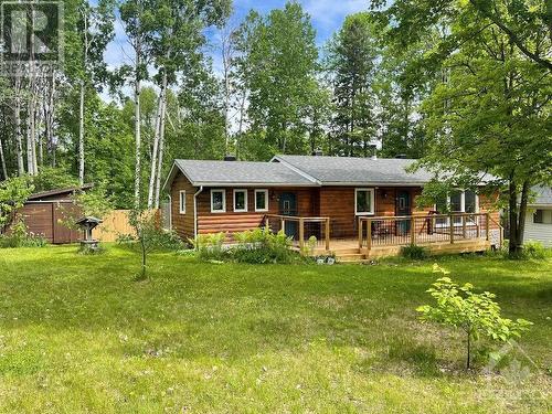 This place checks off all the boxes, gardens, decks, shop, storage. There are lots of fruit trees and mature raspberry canes., - 48 Sunrise Road, Killaloe, ON - Outdoor With Deck Patio Veranda