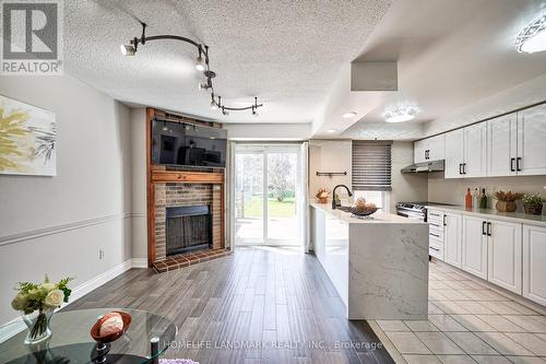 90 James Park Sq, Toronto, ON - Indoor Photo Showing Kitchen With Fireplace