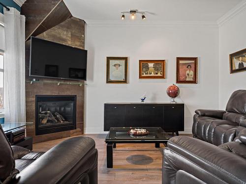 Living room - 256 Ch. De La Pinède, Piedmont, QC - Indoor Photo Showing Living Room With Fireplace