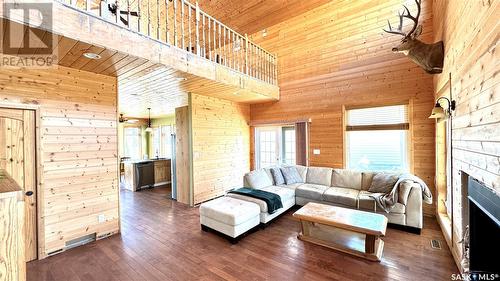 243 Ruby Drive, Hitchcock Bay, SK - Indoor Photo Showing Living Room With Fireplace