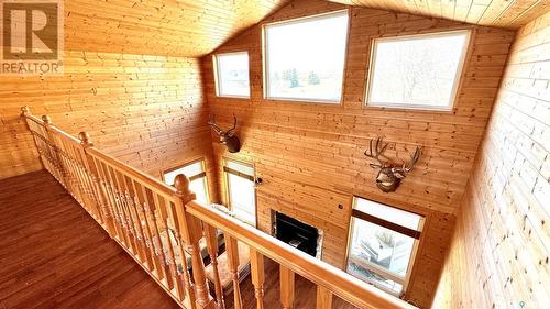 243 Ruby Drive, Hitchcock Bay, SK - Indoor Photo Showing Other Room With Fireplace