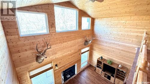 243 Ruby Drive, Hitchcock Bay, SK - Indoor Photo Showing Other Room With Fireplace