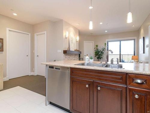 205-1335 Bear Mountain Pkwy, Langford, BC - Indoor Photo Showing Kitchen With Double Sink