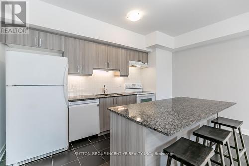#404 -6 Spice Way, Barrie, ON - Indoor Photo Showing Kitchen With Double Sink With Upgraded Kitchen