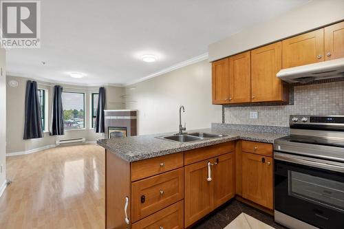 402 6963 Victoria Drive, Vancouver, BC - Indoor Photo Showing Kitchen With Double Sink
