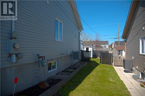 Side Yard leading to Backyard - Blueberries along the house! - 450 Marc Andre Street, Hawkesbury, ON - Outdoor With Exterior