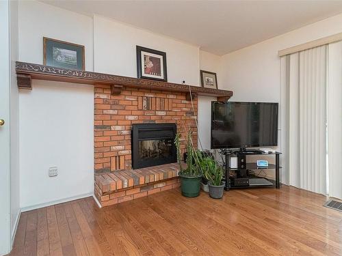4042 Cavallin Crt, Saanich, BC - Indoor Photo Showing Living Room With Fireplace
