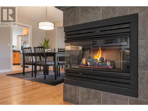 3936 Gallaghers Parkway, Kelowna, BC - Indoor Photo Showing Other Room With Fireplace