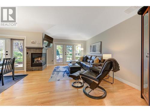 3936 Gallaghers Parkway, Kelowna, BC - Indoor Photo Showing Living Room With Fireplace