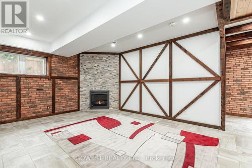 20 Tasker Street, St. Catharines, ON - Indoor Photo Showing Other Room With Fireplace